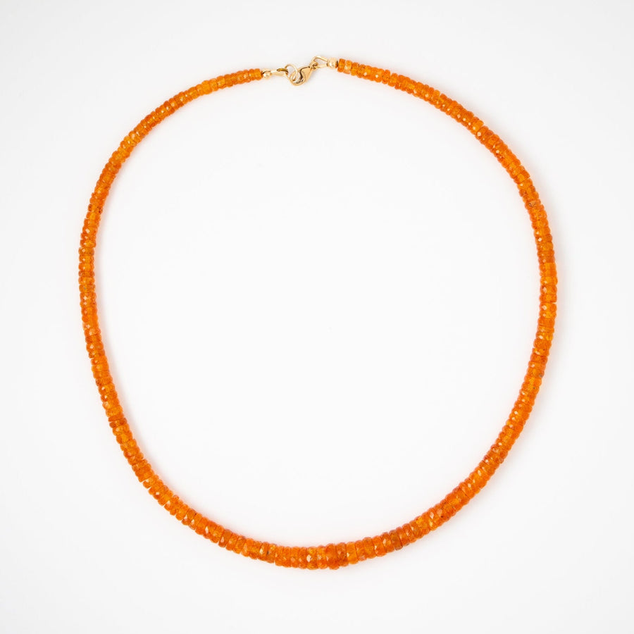 Orange garnet beaded necklace on a white background